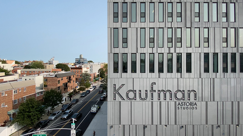 View looking at Kaufman grey panelled façade and down 34th Street.